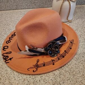 Stylish Peach Fedora with Musical Motif and Floral Detail